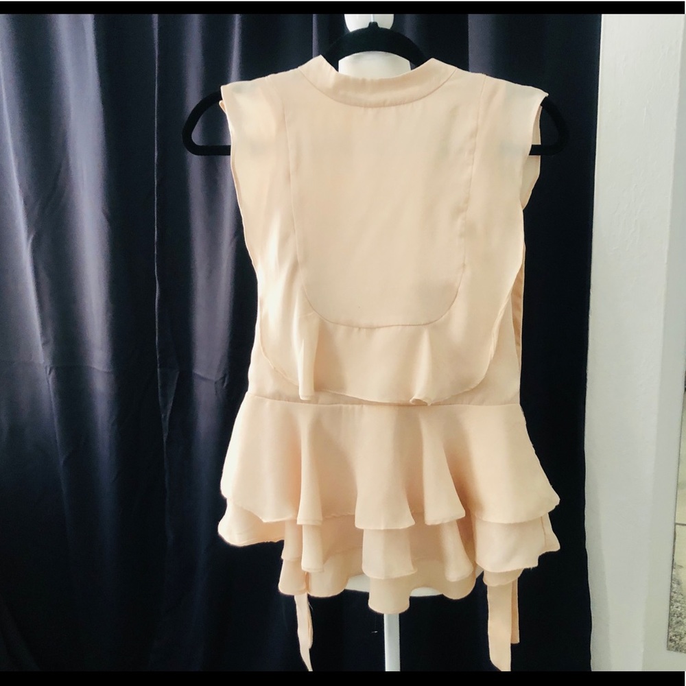 Light pink ruffled blouse
